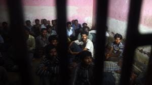 Indian fisherman sit in a police lockup in Karachi on March 26, 2017 after they were arrested by Pakistan coast guards.(AFP File Photo) Indian fisherman sit in a police lockup in Karachi on March 26, 2017 after they were arrested by Pakistan coast guards.(AFP File Photo)