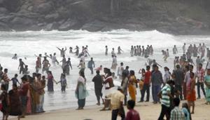 People at Kerala’s Kovalam beach, which is considered one of the major tourist attractions in the country. The 33-year-old Latvian tourist, Liga, went missing from the beach on March 14.(AP Photo) People at Kerala’s Kovalam beach, which is considered one of the major tourist attractions in the country. The 33-year-old Latvian tourist, Liga, went missing from the beach on March 14.(AP Photo)