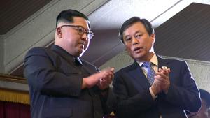 This picture captured from a video footage by Korea Pool reporters shows North Korean leader Kim Jong Un (left) and South Korea's culture minister Do Jong-whan (R) during a rare concert by South Korean musicians at the 1,500-seat East Pyongyang Grand Theatre in Pyongyang.(AFP Photo) This picture captured from a video footage by Korea Pool reporters shows North Korean leader Kim Jong Un (left) and South Korea's culture minister Do Jong-whan (R) during a rare concert by South Korean musicians at the 1,500-seat East Pyongyang Grand Theatre in Pyongyang.(AFP Photo)