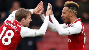 Arsenal's Nacho Monreal and Pierre-Emerick Aubameyang celebrate after the Premier League match vs Stoke City at the Emirates Stadium in London.(Reuters) Arsenal's Nacho Monreal and Pierre-Emerick Aubameyang celebrate after the Premier League match vs Stoke City at the Emirates Stadium in London.(Reuters)