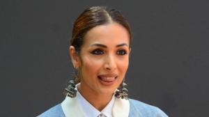 An ethereal white dress sings summer like nothing else, as demonstrated by Malaika Arora. Scroll to see her dress. (IANS)
