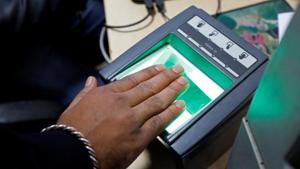 A woman goes through the process of finger scanning for the Unique Identification (UID) database system, also known as Aadhaar, at a registration centre in New Delhi.(Reuters File Photo) A woman goes through the process of finger scanning for the Unique Identification (UID) database system, also known as Aadhaar, at a registration centre in New Delhi.(Reuters File Photo)