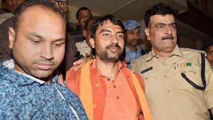 Union minister of state Ashwini Kumar Choubey's son and RSS leader Arijit Shashwat is taken away after he was arrested by the police near Mahavir Temple for allegedly triggering communal violence, in Patna on April 1, 2018.(PTI Photo) Union minister of state Ashwini Kumar Choubey's son and RSS leader Arijit Shashwat is taken away after he was arrested by the police near Mahavir Temple for allegedly triggering communal violence, in Patna on April 1, 2018.(PTI Photo)