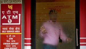 A man leaves an automated teller machine (ATM) facility of Punjab National Bank (PNB) in New Delhi on February 27, 2018.(REUTERS)