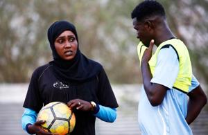 Salma al-Majidi, acknowledged by FIFA as the first Arab and Sudanese woman to coach a men's football team in the Arab world, coaches players of the Al-Ahly Al-Gadaref club during a training session in the town of Gedaref, east of Khartoum on February 17, 2018.(AFP) Salma al-Majidi, acknowledged by FIFA as the first Arab and Sudanese woman to coach a men's football team in the Arab world, coaches players of the Al-Ahly Al-Gadaref club during a training session in the town of Gedaref, east of Khartoum on February 17, 2018.(AFP)