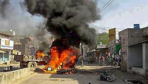 Smoke billows from a burning bus during 'Bharat Bandh' call by Dalit organisations against the alleged dilution of Scheduled Castes/Scheduled Tribes Act, in Alwar on Monday.(PTI) Smoke billows from a burning bus during 'Bharat Bandh' call by Dalit organisations against the alleged dilution of Scheduled Castes/Scheduled Tribes Act, in Alwar on Monday.(PTI)