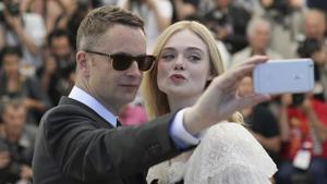 In this May 20, 2016 file photo, director Nicolas Winding Refn and actress Elle Fanning pose for a selfie photograph during a photo call for the film The Neon Demon at the 69th international film festival, Cannes.(AP) In this May 20, 2016 file photo, director Nicolas Winding Refn and actress Elle Fanning pose for a selfie photograph during a photo call for the film The Neon Demon at the 69th international film festival, Cannes.(AP)
