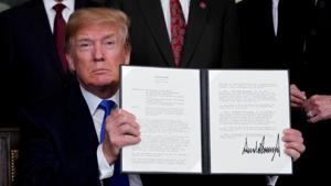 US President Donald Trump holds his signed memorandum on intellectual property tariffs on high-tech goods from China, at the White House in Washington on March 22, 2018.(Reuters File Photo) US President Donald Trump holds his signed memorandum on intellectual property tariffs on high-tech goods from China, at the White House in Washington on March 22, 2018.(Reuters File Photo)