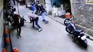 A video grab showing men with masked faces beating up victim Sunil Kumar in Jind on Thursday.(HT Photo)