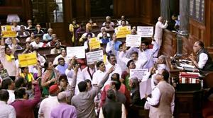 Opposition members protest in the well of the Rajya Sabha on Thursday.(PTI photo)