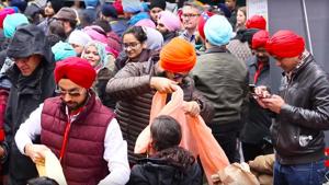 Sikhs tie turbans to mark the ‘Turban Day’ celebrations at the Times Square in New York on Saturday.(A grab from a YouTube video) Sikhs tie turbans to mark the ‘Turban Day’ celebrations at the Times Square in New York on Saturday.(A grab from a YouTube video)