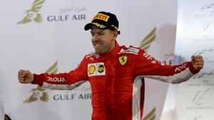 Ferrari's Sebastian Vettel celebrates on the podium after winning the Bahrain Grand Prix on Sunday.(REUTERS) Ferrari's Sebastian Vettel celebrates on the podium after winning the Bahrain Grand Prix on Sunday.(REUTERS)