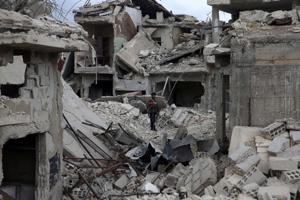 A man stands on rubble of damaged buildings in the besieged town of Douma, Eastern Ghouta, in Damascus, Syria March 30, 2018.(Reuters Photo) A man stands on rubble of damaged buildings in the besieged town of Douma, Eastern Ghouta, in Damascus, Syria March 30, 2018.(Reuters Photo)