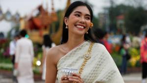 A woman dressed in traditional costume smiles at the Royal Plaza, as interest for historical clothing rises within the country.(REUTERS) A woman dressed in traditional costume smiles at the Royal Plaza, as interest for historical clothing rises within the country.(REUTERS)