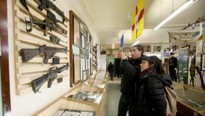 Tourists being guided by Peadar Whelan look at weapons in Republican museum.(AFP) Tourists being guided by Peadar Whelan look at weapons in Republican museum.(AFP)