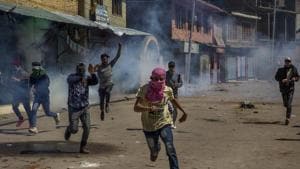 Kashmiri villagers run for cover as government forces fire pellets and tear gas at them after they were stopped from taking part in the funeral procession of Kashmiri militant Mussavir Wani in Pulwama, on April 7.(AP file photo) Kashmiri villagers run for cover as government forces fire pellets and tear gas at them after they were stopped from taking part in the funeral procession of Kashmiri militant Mussavir Wani in Pulwama, on April 7.(AP file photo)