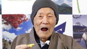 Japanese Masazo Nonaka, who is 112 years old, eats his favourite cake as he receives a Guinness World Records certificate naming him the world’s oldest man during a ceremony in Ashoro on Monday.(Reuters Photo) Japanese Masazo Nonaka, who is 112 years old, eats his favourite cake as he receives a Guinness World Records certificate naming him the world’s oldest man during a ceremony in Ashoro on Monday.(Reuters Photo)