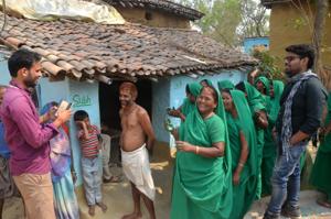 The ‘Green Crusaders’ from an NGO Hope outside a house in a village that has been declared alcohol, tobacco -free.(HT Photo) The ‘Green Crusaders’ from an NGO Hope outside a house in a village that has been declared alcohol, tobacco -free.(HT Photo)