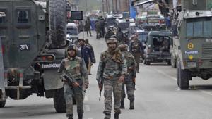 Security personnel patrol the streets following an encounter with militants in Khudwani village, Kulgam district, south Kashmir, on Wednesday.(Waseem Andrabi/HT Photo) Security personnel patrol the streets following an encounter with militants in Khudwani village, Kulgam district, south Kashmir, on Wednesday.(Waseem Andrabi/HT Photo)