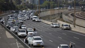 People stand still as a two-minutes silence in memory of victims of the Holocaust in Tel Aviv, Israel.(AP Photo) People stand still as a two-minutes silence in memory of victims of the Holocaust in Tel Aviv, Israel.(AP Photo)