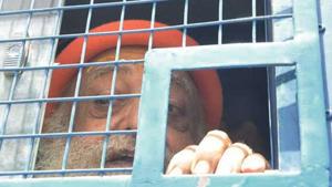 Asaram looks out from the police van while on way to attend the hearing in a court in Jodhpur.(HT File) Asaram looks out from the police van while on way to attend the hearing in a court in Jodhpur.(HT File)