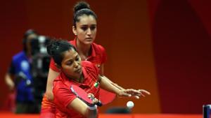 Mouma Das and Manika Batra lost the gold medal match to Tianwei Feng and Yu Mengyu of Singapore in three straight games.(AFP) Mouma Das and Manika Batra lost the gold medal match to Tianwei Feng and Yu Mengyu of Singapore in three straight games.(AFP)