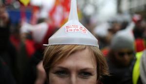 A protester attends a demonstration during a national day of strike against reforms in Paris, France, March 22(REUTERS) A protester attends a demonstration during a national day of strike against reforms in Paris, France, March 22(REUTERS)