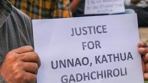 People display placards during a protest against the Kathua and Unnao rape cases.(PTI Photo) People display placards during a protest against the Kathua and Unnao rape cases.(PTI Photo)
