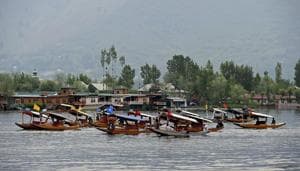 Boatmen row their boats during Shikara Festival at Dal Lake in Srinagar .(PTI File Photo)