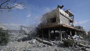 Damage is shown of the Syrian Scientific Research Center which was attacked by U.S., British and French military strikes to punish President Bashar Assad for suspected chemical attack against civilians, in Barzeh, near Damascus, Syria, Saturday, April 14, 2018.(AP)