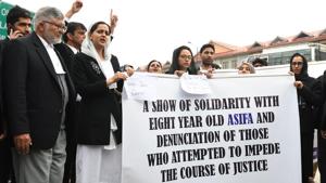 Kashmiri lawyers stand behind a banner during a protest calling for justice following the recent rape and murder case of an eight-year-old girl in Srinagar, on Monday.(AFP Photo) Kashmiri lawyers stand behind a banner during a protest calling for justice following the recent rape and murder case of an eight-year-old girl in Srinagar, on Monday.(AFP Photo)
