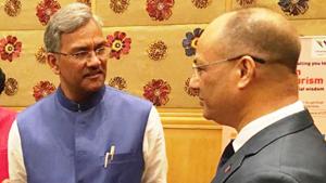Chief minister Trivendra Singh Rawat (L) with a Thai official at a seminar in Bangkok on Tuesday.(HT Photo)