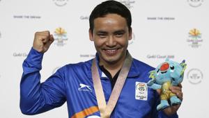 Jitu Rai of India poses with his gold medal in the men's 10m Air Pistol final at the 2018 Commonwealth Games in Gold Coast.(AP) Jitu Rai of India poses with his gold medal in the men's 10m Air Pistol final at the 2018 Commonwealth Games in Gold Coast.(AP)