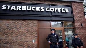 Police officers monitor activity outside as protestors demonstrate inside a Center City Starbucks, where two black men were arrested, in Philadelphia, Pennsylvania US, on April 16, 2018.(Reuters) Police officers monitor activity outside as protestors demonstrate inside a Center City Starbucks, where two black men were arrested, in Philadelphia, Pennsylvania US, on April 16, 2018.(Reuters)