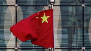 A Chinese national flag flutters at the headquarters of a bank in Beijing.(Reuters file photo) A Chinese national flag flutters at the headquarters of a bank in Beijing.(Reuters file photo)