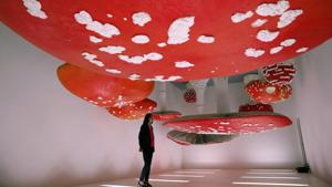 A woman looks at the installation "Upside Down Mushroom Room " by Carsten Holler, part of the Design Week, at the Prada's foundation, in Milan, Italy.(AP) A woman looks at the installation "Upside Down Mushroom Room " by Carsten Holler, part of the Design Week, at the Prada's foundation, in Milan, Italy.(AP)