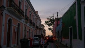Tourists walk along San Sebastian street on Wednesday in Old San Juan, Puerto Rico as a major failure knocked out the electricity in the area.(AFP photo) Tourists walk along San Sebastian street on Wednesday in Old San Juan, Puerto Rico as a major failure knocked out the electricity in the area.(AFP photo)