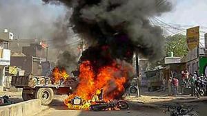 Smoke billows from a burning bus during 'Bharat Bandh' call by Dalit organisations against the alleged dilution of Scheduled Castes/Scheduled Tribes Act, in Alwar on April 2.(PTI File Photo) Smoke billows from a burning bus during 'Bharat Bandh' call by Dalit organisations against the alleged dilution of Scheduled Castes/Scheduled Tribes Act, in Alwar on April 2.(PTI File Photo)