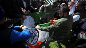 Protesters rip up India's flag after tearing it off a flagpole in Parliament Square, London.(REUTERS) Protesters rip up India's flag after tearing it off a flagpole in Parliament Square, London.(REUTERS)