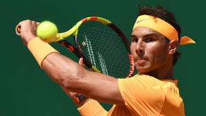 Rafael Nadal plays a backhand return to Dominic Thiem during their singles match at the Monte-Carlo ATP Masters Series tournament in Monaco on Friday.(AFP) Rafael Nadal plays a backhand return to Dominic Thiem during their singles match at the Monte-Carlo ATP Masters Series tournament in Monaco on Friday.(AFP)