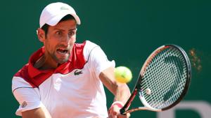 Novak Djokovic returns the ball to Austria's Dominic Thiem during their match at the Monte Carlo Masters tennis tournament.(AFP) Novak Djokovic returns the ball to Austria's Dominic Thiem during their match at the Monte Carlo Masters tennis tournament.(AFP)