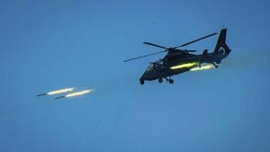 In this photo provided by China's Xinhua News Agency, a Chinese armed helicopter assaults targets with rocket projectiles in a live-fire exercise off China's southeast coast.(AP File Photo) In this photo provided by China's Xinhua News Agency, a Chinese armed helicopter assaults targets with rocket projectiles in a live-fire exercise off China's southeast coast.(AP File Photo)