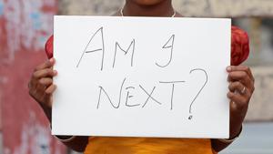 A child holds a placard during a protest against rape, in Kochi on April 15, 2018.(Reuters) A child holds a placard during a protest against rape, in Kochi on April 15, 2018.(Reuters)