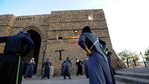 Saudi women stretch before a jog in Jeddah's historic al-Balad district on March 8, 2018. Although the Saudi government is seeking to jump-start women’s sports, it is mandatory for women to wear body-shrouding abaya robes and also cover their hair in public in some areas of the Kingdom.(AFP File Photo) Saudi women stretch before a jog in Jeddah's historic al-Balad district on March 8, 2018. Although the Saudi government is seeking to jump-start women’s sports, it is mandatory for women to wear body-shrouding abaya robes and also cover their hair in public in some areas of the Kingdom.(AFP File Photo)