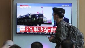 A South Korean army soldier passes by a file footage of North Korea's missile during a news programme at the Seoul Railway Station on April 21, 2018.(AP) A South Korean army soldier passes by a file footage of North Korea's missile during a news programme at the Seoul Railway Station on April 21, 2018.(AP)