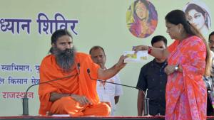 Chief minister Vasundhara Raje and Baba Ramdev release a Swadeshi Samruddhi card at the foundation stone laying ceremony of Patanjali Yogapeeth's branch at Karauli on Sunday.(HT PHOTO) Chief minister Vasundhara Raje and Baba Ramdev release a Swadeshi Samruddhi card at the foundation stone laying ceremony of Patanjali Yogapeeth's branch at Karauli on Sunday.(HT PHOTO)