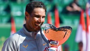 Rafael Nadal holds the trophy as he celebrates his win over Kei Nishikori in the Monte Carlo Masters final.(AFP)