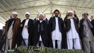 Afghan people offer funeral prayers behind the body of a civilian killed in Sunday's deadly suicide attack at a voter registration center, in Kabul, Afghanistan, on Monday.(AP Photo) Afghan people offer funeral prayers behind the body of a civilian killed in Sunday's deadly suicide attack at a voter registration center, in Kabul, Afghanistan, on Monday.(AP Photo)