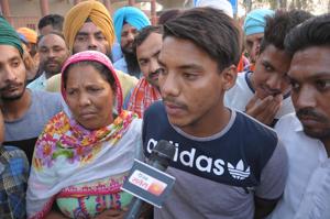 Amarjit Singh with his family members after he was deported by Pakistan on Tuesday from Attari border, in Amritsar on Tuesday.(HT Photo) Amarjit Singh with his family members after he was deported by Pakistan on Tuesday from Attari border, in Amritsar on Tuesday.(HT Photo)
