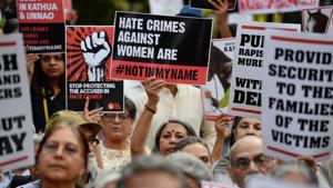 Demonstrators hold placards during a protest in support of rape victims following cases in Kathua, Unnao and Surat.(AFP Photo) Demonstrators hold placards during a protest in support of rape victims following cases in Kathua, Unnao and Surat.(AFP Photo)